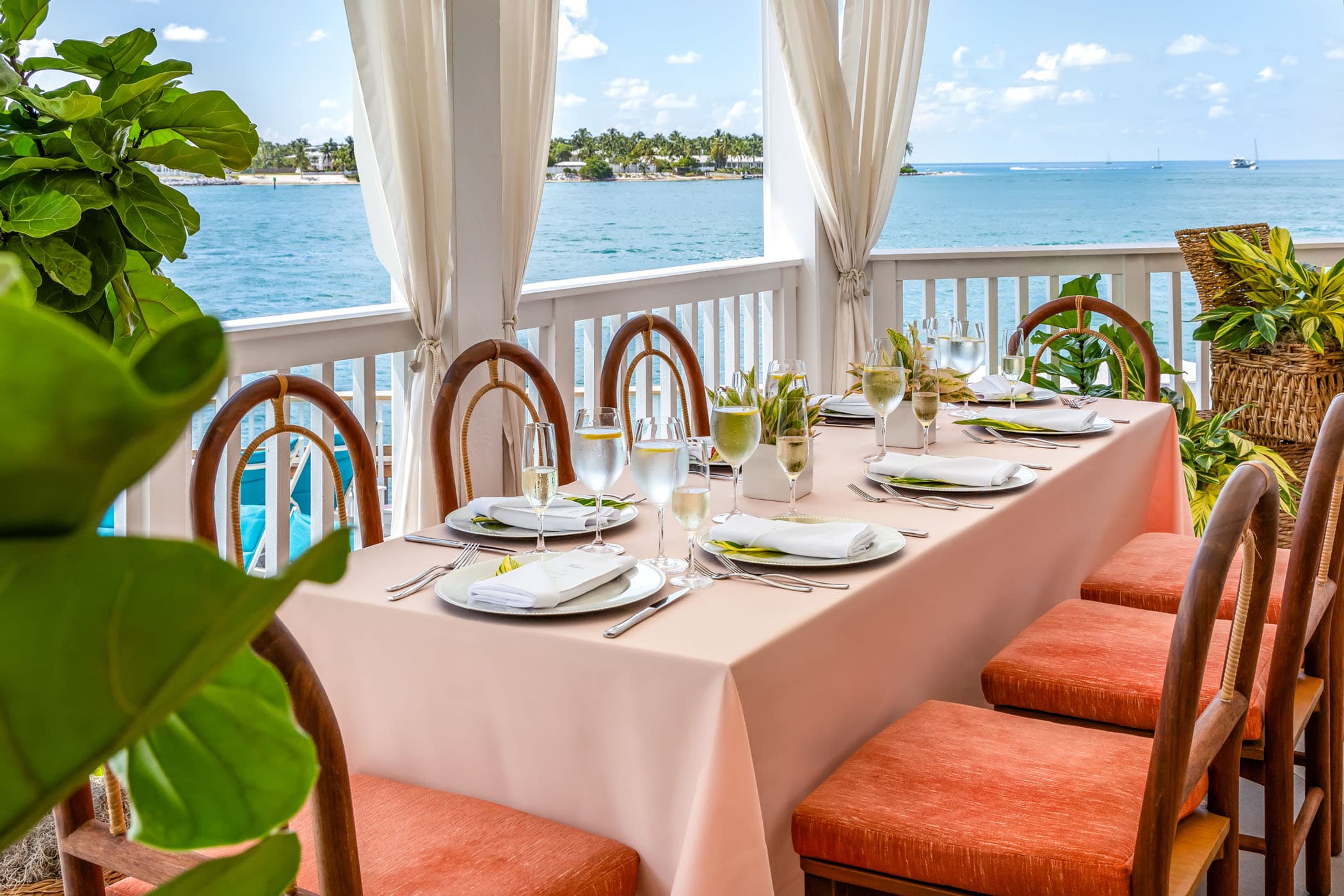A table set for a dinner on a balcony at Ocean Key Resort