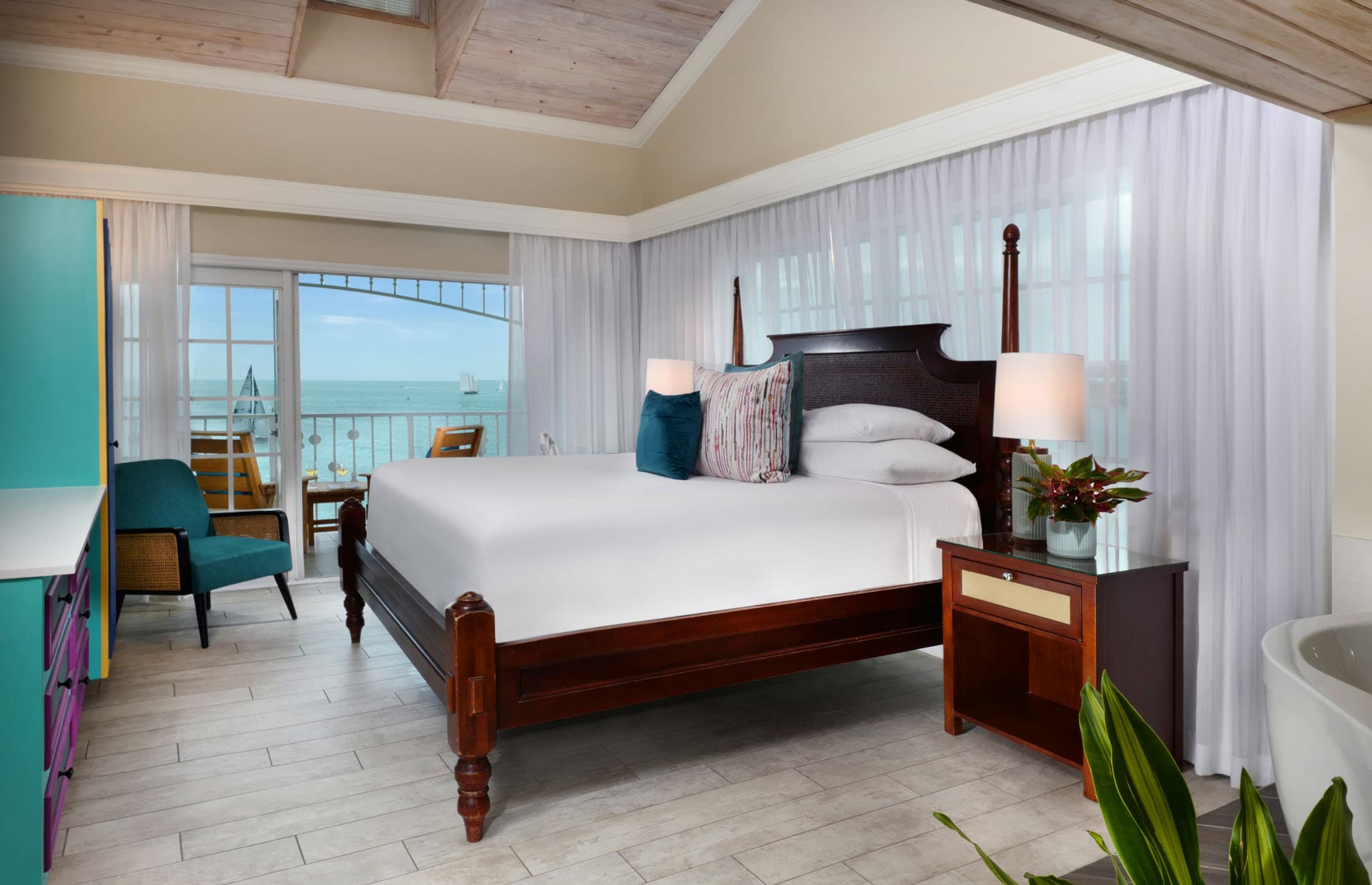 A large bed and balcony at ocean Key resort